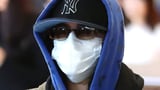 Guess who! World famous pop star goes incognito as she lands in Melbourne ahead of sold-out...
