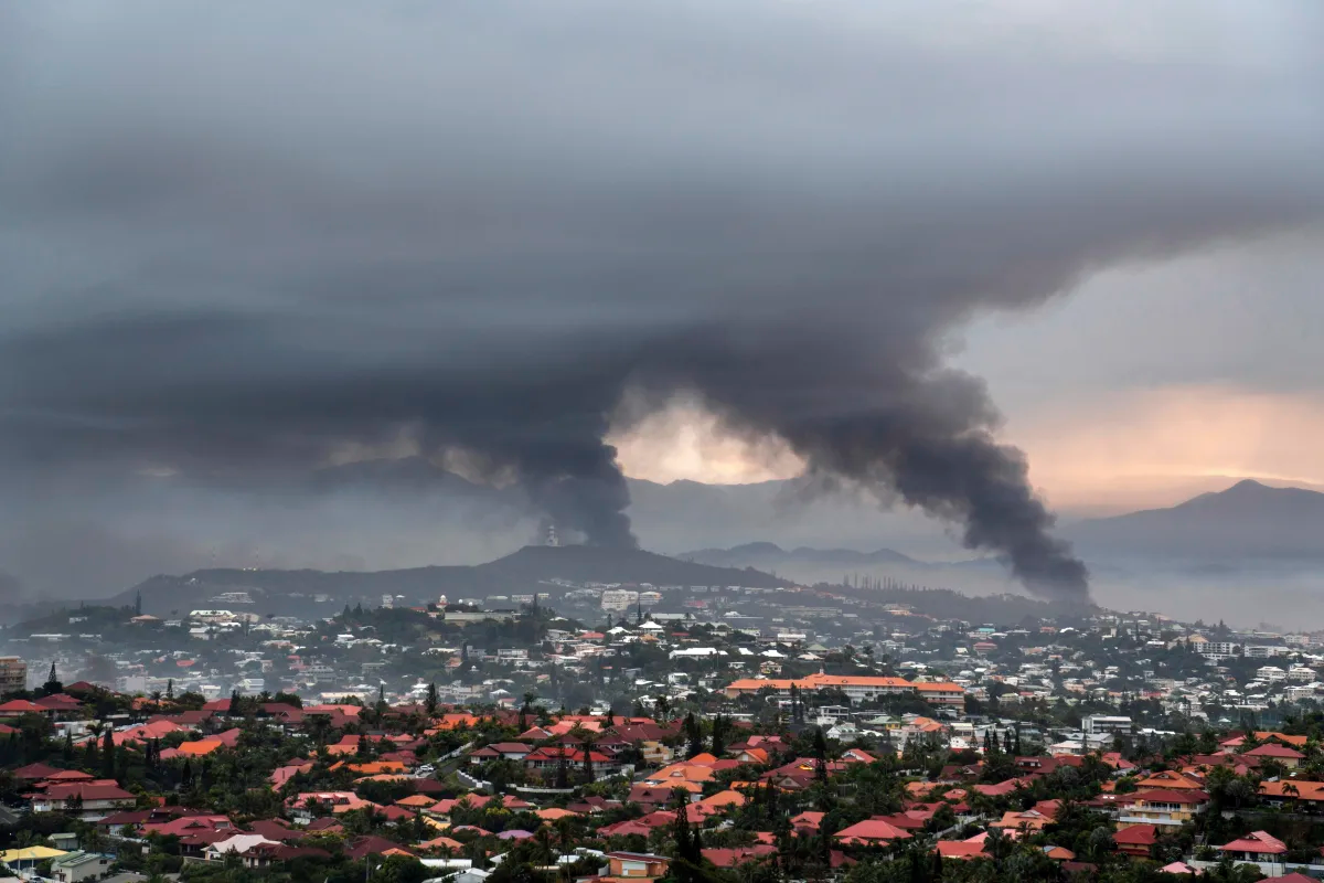 New Caledonia reopening its international airport and shortening curfew as unrest continues to ebb