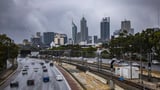 Perth shivers through coldest day in 50 years as residents marvel at rain, hail