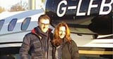 Married couple caught in £28m holiday investment scam pose by private jet