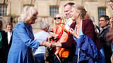 Queen Camilla quotes 'togetherness' proverb at her literary festival amid war of words between Palace and Earl Spencer over his Diana memoir