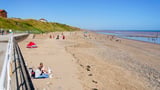 Desperate search for missing boy after he got into difficulty swimming at popular beach as emergency crews rush to scene