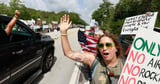 Protesters line highway in Florida Everglades to oppose 'Alligator Alcatraz' - Los Angeles Times