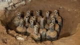 35 bottles from the 18th century filled with cherries unearthed by archeologists at George Washington’s Mount Vernon