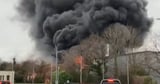 Huge blaze seen for miles as residents report hearing 'popping sound' explosions
