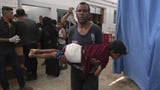 74 killed in Gaza as Israeli forces strike a cafe and fire on people seeking food | AP News