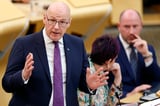 John Swinney's plan to slash NHS boards faces fierce union backlash