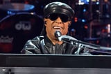 Stevie Wonder Reacts to Rumors He Can Actually See at Cardiff Show: 'You Know the Truth'