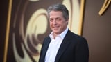 Hugh Grant says he got 'enormous sum' to settle suit alleging illegal snooping by The Sun tabloid