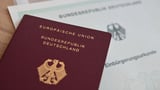 German naturalizations top 300,000 for first time in 2025, report says
