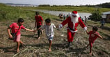 Father Christmas delivers gifts to Brazilian Amazon communities