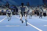 Robots race, play football, crash and collapse at China's 'robot Olympics'