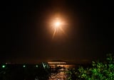 SpaceX Falcon 9 rocket flashes fiery multicolored exhaust across nighttime sky Thursday