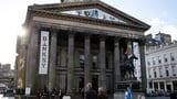 Horror at four-floor gallery as man plunges from a balcony and is rushed to hospital - as visitors...