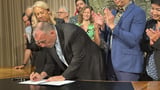 Hawaii's governor signs new hotel tax legislation to help cope with climate change | AP News