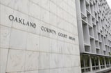 Michigan woman pleads no contest to abuse after 3 kids are found living alone for years