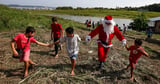 Santa Claus Braves Amazon Jungle To Bring Gifts To Children