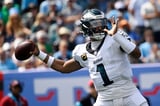Eagles beat Titans 24-20 on Hurts' late TD pass to Cooper | AP News