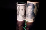 US dollar rises against yen as markets eye Iran deal, jobs report