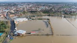 Britain underwater: Cricket ground in Worcestershire is completely submerged after 40 days of rain with more than 300 areas across UK at risk of further flooding