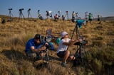 Millions crowd Spanish cities for a total solar eclipse | AP News