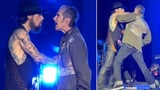 Moment lead singer of iconic rock band Jane's Addiction explodes onstage, punches guitarist mid-song