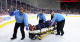 NHL referee Mitch Dunning taken off ice on stretcher after violent collision during Philadelphia Flyers game