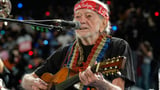 Willie Nelson keeps living the life he loves at 92. 'I'm not through with it yet' | AP News