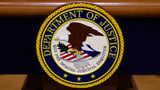 Justice Department says 2 Chinese nationals charged with spying inside the US for Beijing