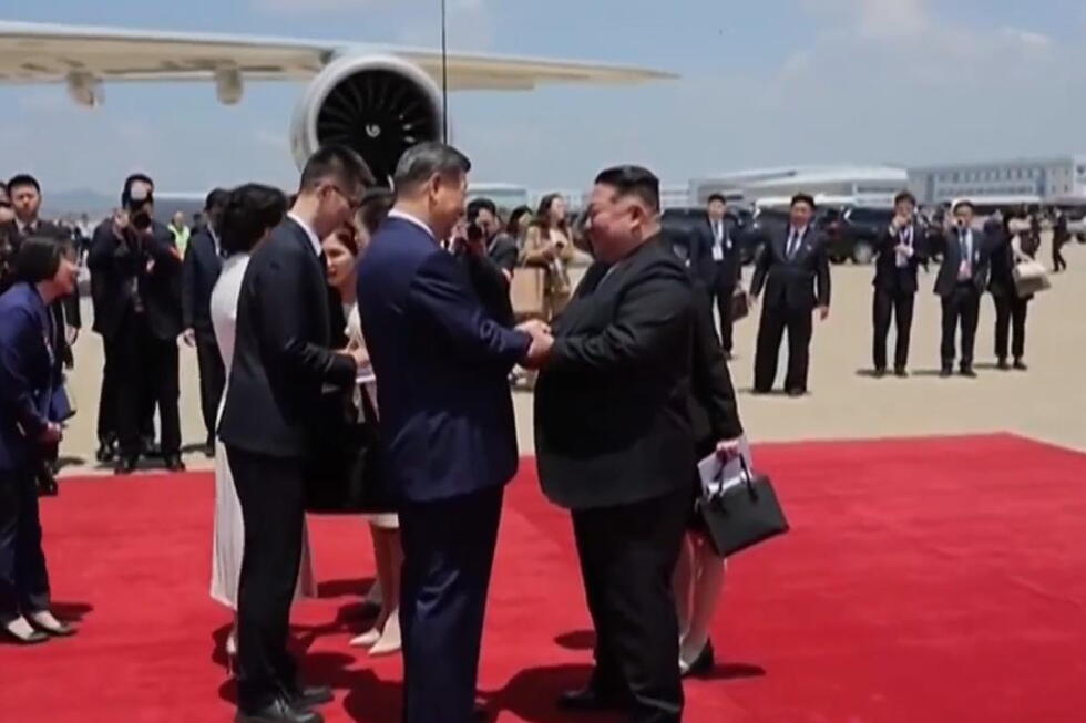 North Korean state TV shows leader Kim Jong Un welcoming Chinese President Xi in Pyongyang | AP News