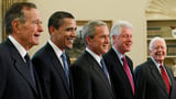 Trump goes unmentioned but not ignored as Clinton, Bush and Obama step up as essayists on presidents