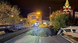 Father and son are swallowed up by sinkhole in flood-ravaged Italy while tourists are told to stay...