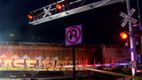 One child missing and another injured after train hits family on railroad bridge, killing two adults