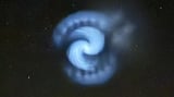 Mystery as huge spinning white spiral spotted in the skies above Britain