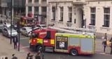 Huge blaze rips through block of flats as 100 firefighters rush to scene
