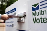 Federal judge extends block on Trump executive order seeking to limit mail voting in the midterms