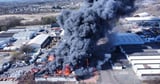 Huge blaze erupts as six in hospital and locals warned 'stay indoors'
