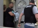 Four arrested after dawn raids targeting suspected people smugglers