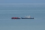 First migrants arrive in UK from France under the 'one in, one out' policy