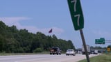 Massive Confederate flagpole near I-85 lowered after court order