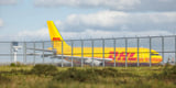 At least 1 person is dead after a DHL cargo plane crashed into a house