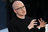 Coinbase Billionaire Says U.S. Investment Laws Make It 'Illegal To Get Richer'
