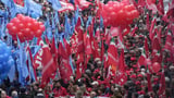 Thousands of workers march across Italy in general strike demanding better pay and services