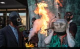 Climate Change Activists Pretend To Drown Themselves In Oil Outside UN Agency In London