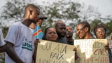 Families of the victims of attacks on displaced people in Congo mourn their dead