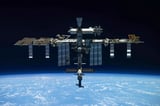 Space station astronauts briefly take shelter during repair to fix leak | AP News
