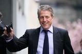 Hugh Grant settles phone hacking claim against The Sun’s publisher