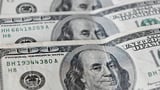 Dollar firm after Powell pushes back on aggressive easing bets