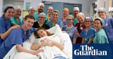Woman becomes first UK womb transplant recipient to give birth – video