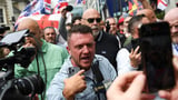 Tommy Robinson leads thousand-strong march as arrests made